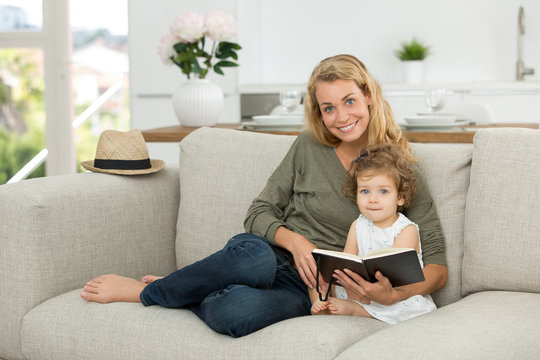 mother and daughter with book