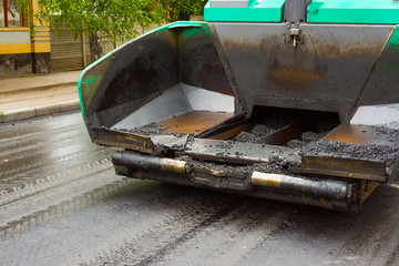 photo laying of new asphalt pavement  