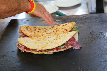 cooked flat bread also called piadina in italian language on the