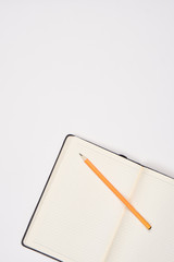 white background, notebook, pencil