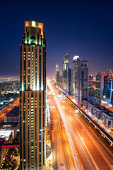 Amazing night dubai downtown skyline and traffic jam during rush hour. Sheikh Zayed road, Dubai, United Arab Emirates - 180787044