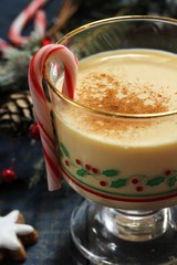 Eggnog - Xmas Holiday drink on festive blue background