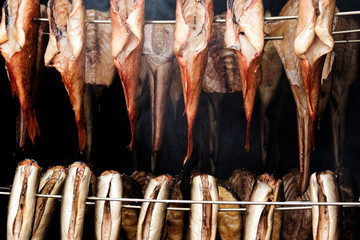 Smoked fish hanging in a smokehouse
