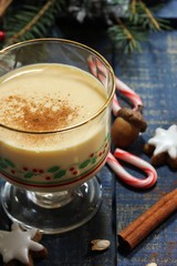 Eggnog - Xmas Holiday drink on festive blue background