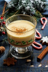 Eggnog - Xmas Holiday drink on festive blue background