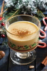 Eggnog - Xmas Holiday drink on festive blue background