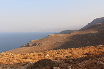 Mediterranean Sea view with the rough terrain of the Balos Lagoon trail in northwestern part of Crete Island in Greece. 