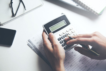 man hand document and calculator