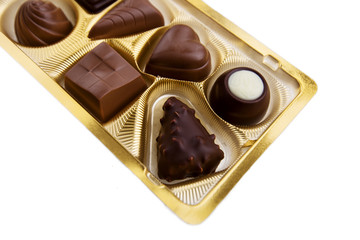 A collection of mixed chocolates against on a white background