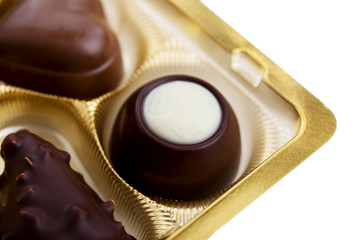 A collection of mixed chocolates against a white background