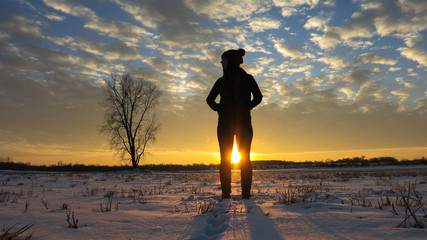 Girl in Frozen Field at Sunset