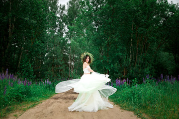 Fototapeta na wymiar The bride is spinning in her dress