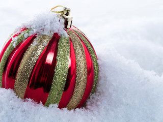 Christmas ball on snow