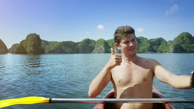 Joyful Man Makes Selfie Waves Hand Sails in Kayak