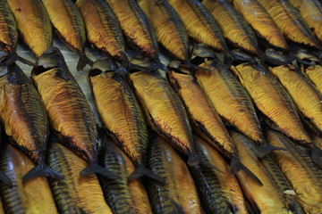 Smoked mackerel on market stall