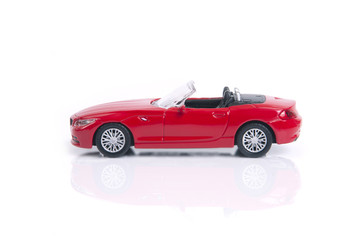 Red toy or model convertible sport car.