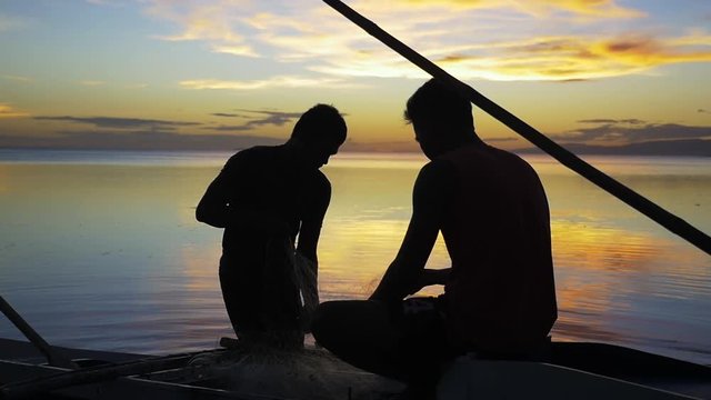 Scenic sunset over people on boat, Philippines