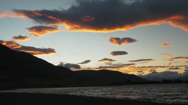 Scenic sunset over New Zealand lake