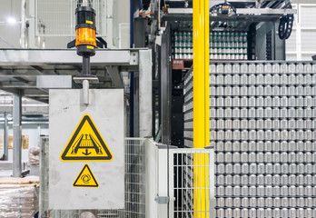 Canned food stacking on plastic pallet in Automated High/Low-level Depalletizer Machine