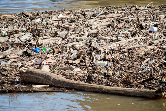 Large Pile of Trash and Wood in the River