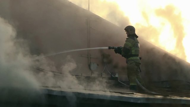 Firefighters extinguish a fire.