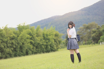 Obraz premium Japanese school in countryside with grass mountain and tree