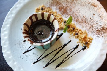 Fototapeta premium Chocolate lava cake on wood background