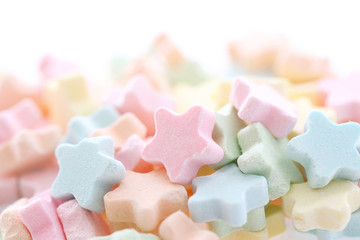Colourful Star Milk pellets isolated in white background