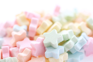 Colourful Star Milk pellets isolated in white background