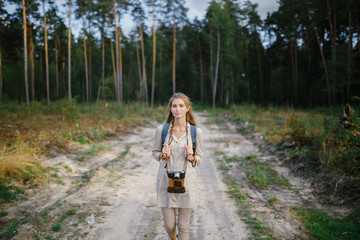 Young girl walking in the forest