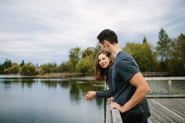 Couple at the lake looking at each other