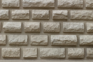 The wall of the fortress in the city of Essentuki is made of a large yellow brick. A close-up of the masonry.