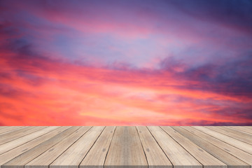 Empty table top on blurred beautiful sky at sunset