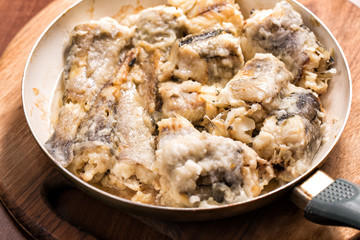 Fried pollock in the pan