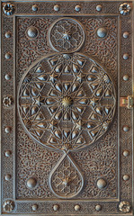 Ornaments of the bronze-plate ornate door of the mosque of The Manial Palace of Prince Mohammed Ali Tewfik, Cairo, Egypt