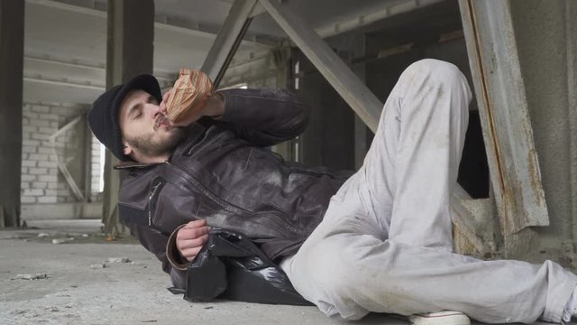 Homeless man drinks alcohol