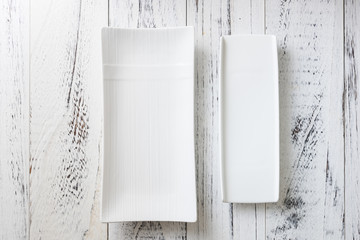 White rectangular Plate on white wooden  wooden background