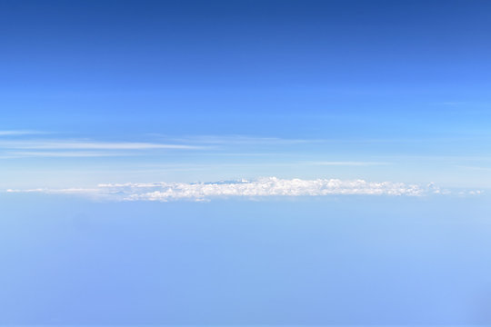 Clouds on the blue horizon as background with copy space on top and bottom