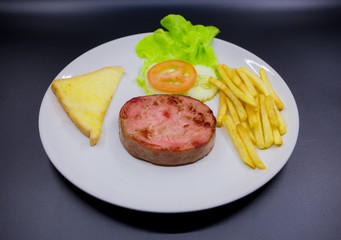 Ham steak on a plate
