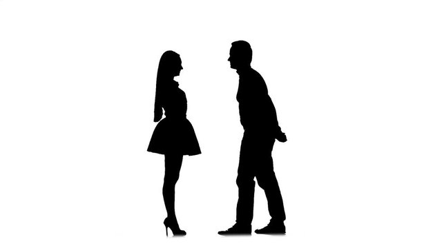 Guy proposes to marry the girl, she says yes. Silhouette. White background. Slow motion