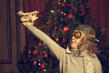 the girl dreams to become a pilot in front of the tree