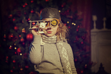 girl in a helmet plays with the plane © sigma1850