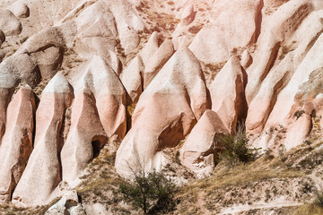 Rose or Red valley landscape in Cappadocia, Turkey. Scenic Background with rocky hills of sandstone and tuff. Geological and tourist concept
