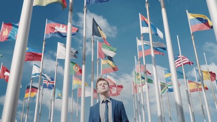 An optimistic clip of the unity of all countries and nations and a bright future against the background of the flags of all countries and the clear sky and airplane