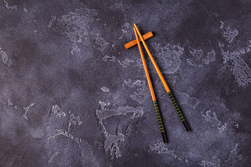 chopsticks on dark table