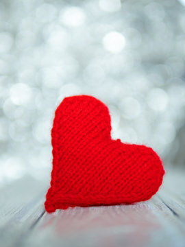 red heart from threads on bokeh background