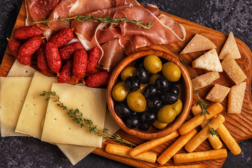 Sausage olives prosciutto cheese bread sticks.