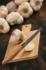 Garlic Cloves and Garlic Bulb on vintage wood background