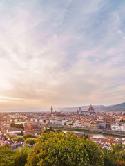 Fototapeta na wymiar Florence cityscape with Ponte Vecchio bridge, Santa Maria del Fiore cathedral and spectacular sunset sky.