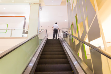 escalator step inside building, interior escalator